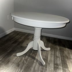 White, Round Wooden Table 