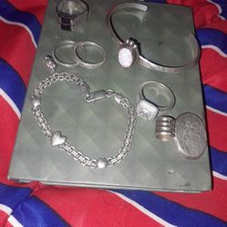7 pieces of sterling silver. 925   one charm 2 bracelets and 4 rings