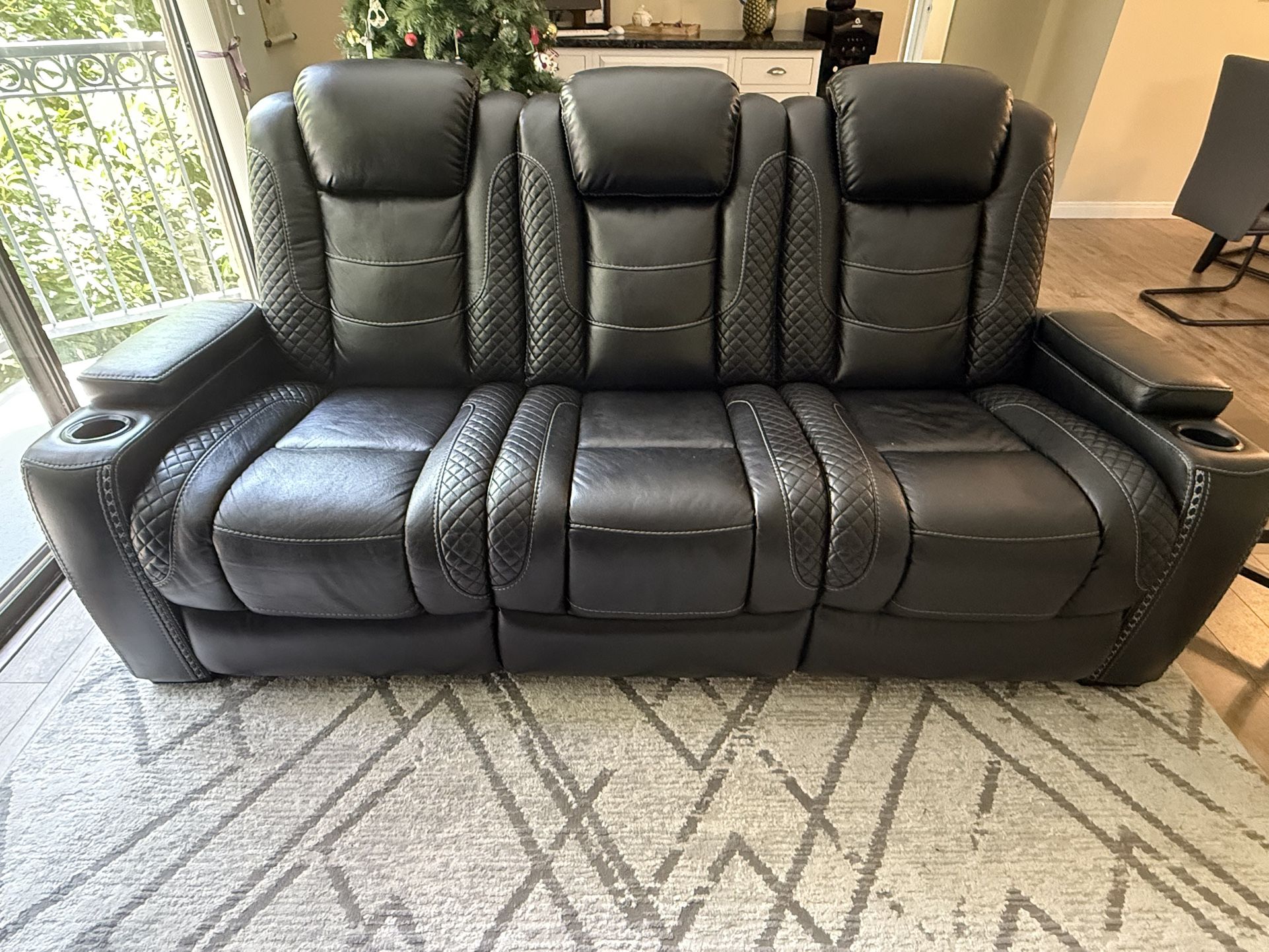 Black reclinable leather sofa