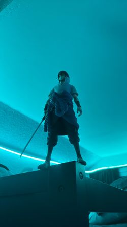 Playable-standing action figure of Sasuke from Naruto