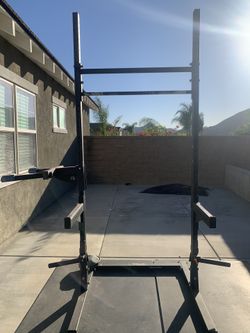Rogue squat rack w dip station, weight racks, safety bars, 2 mats, bench chair