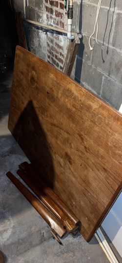 Wooden table with extendable leaves
