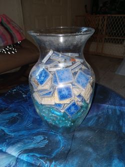 Jar of mosaic blue tiles & other stones