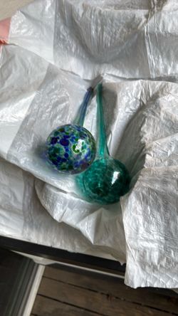 Two plant watering bulbs