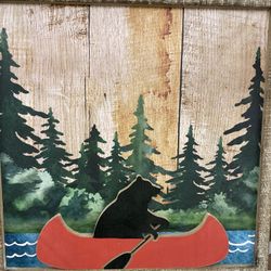 Wooden bear in canoe decor