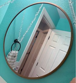 Gold round mirror