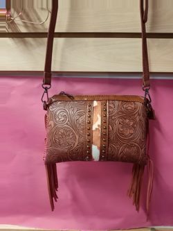 Embossed Western-Inspired Crossbody Handbags

This collection features stylish tooled faux leather
