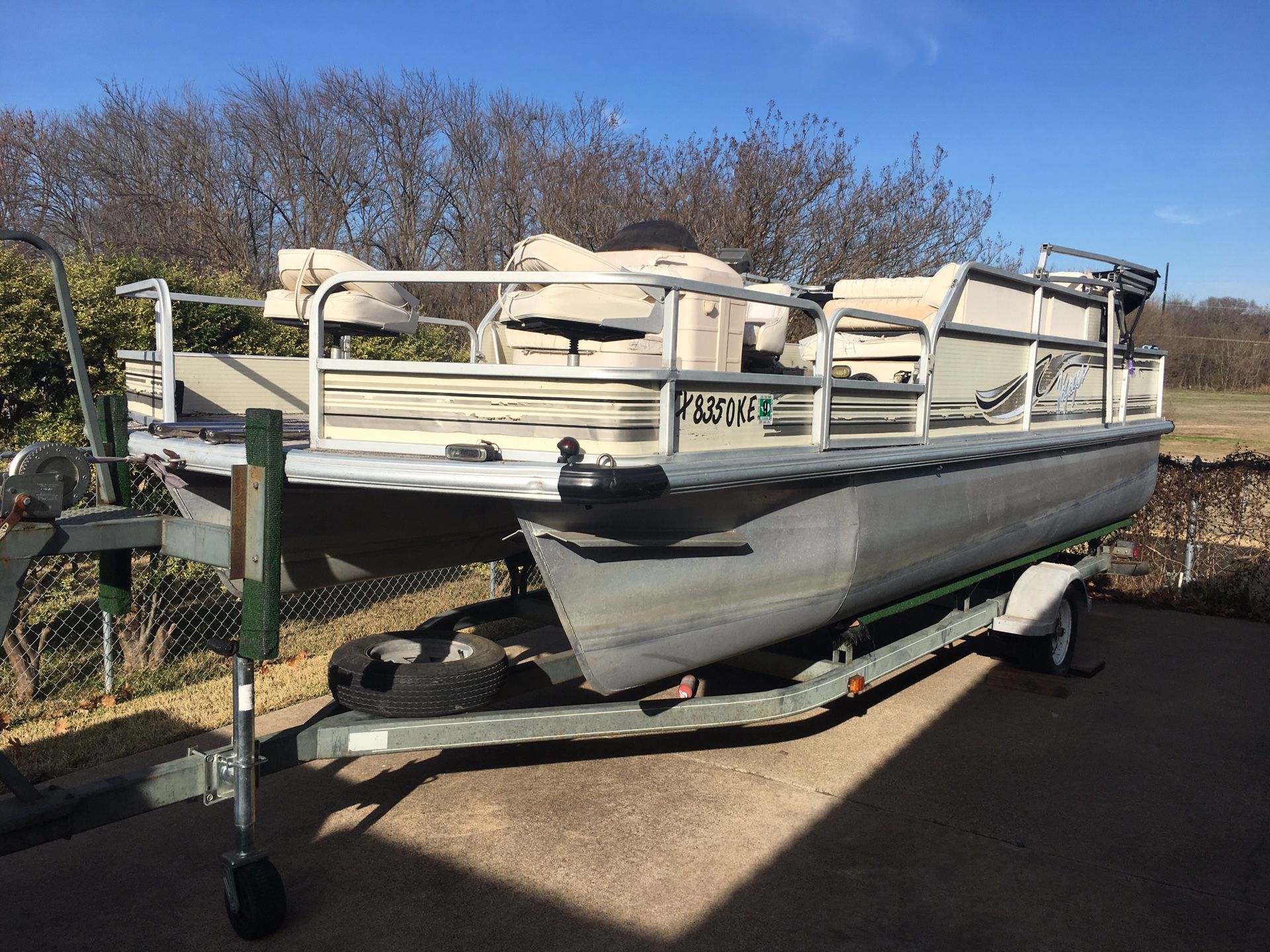99 21 ft Voyager pontoon boat 90 hp mercury and boat trailer runs good Needs upholstery may trade for travel trailer