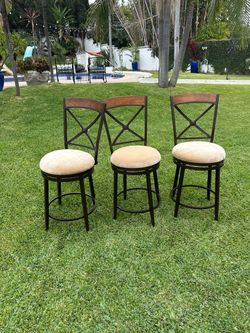 Set of three swivel bar stools
