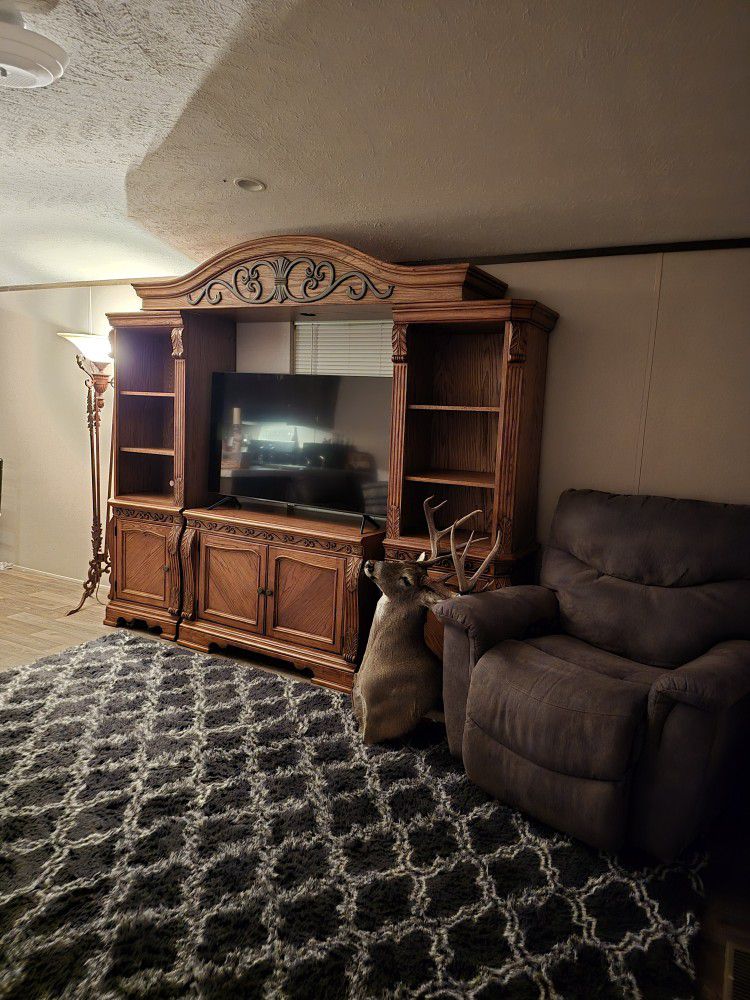 Ashley Furniture 4 Piece Entertainment Center With Light Above The TV and Lots Of Storage Space Below