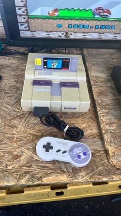 Súper Nintendo. Complete with game $135.