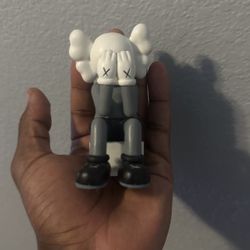 Miniature kanye west Kaws figure 