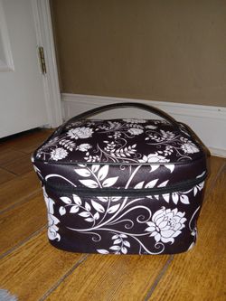 Brown and white floral leather makeup bag