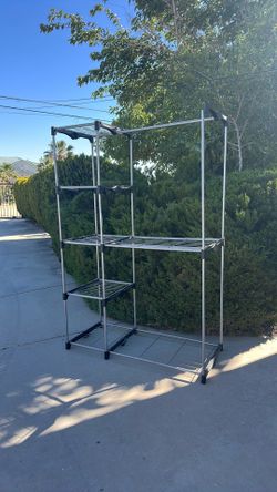 Clothes rack with shelves