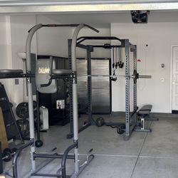 Squat Rack With Barbell and Weights 