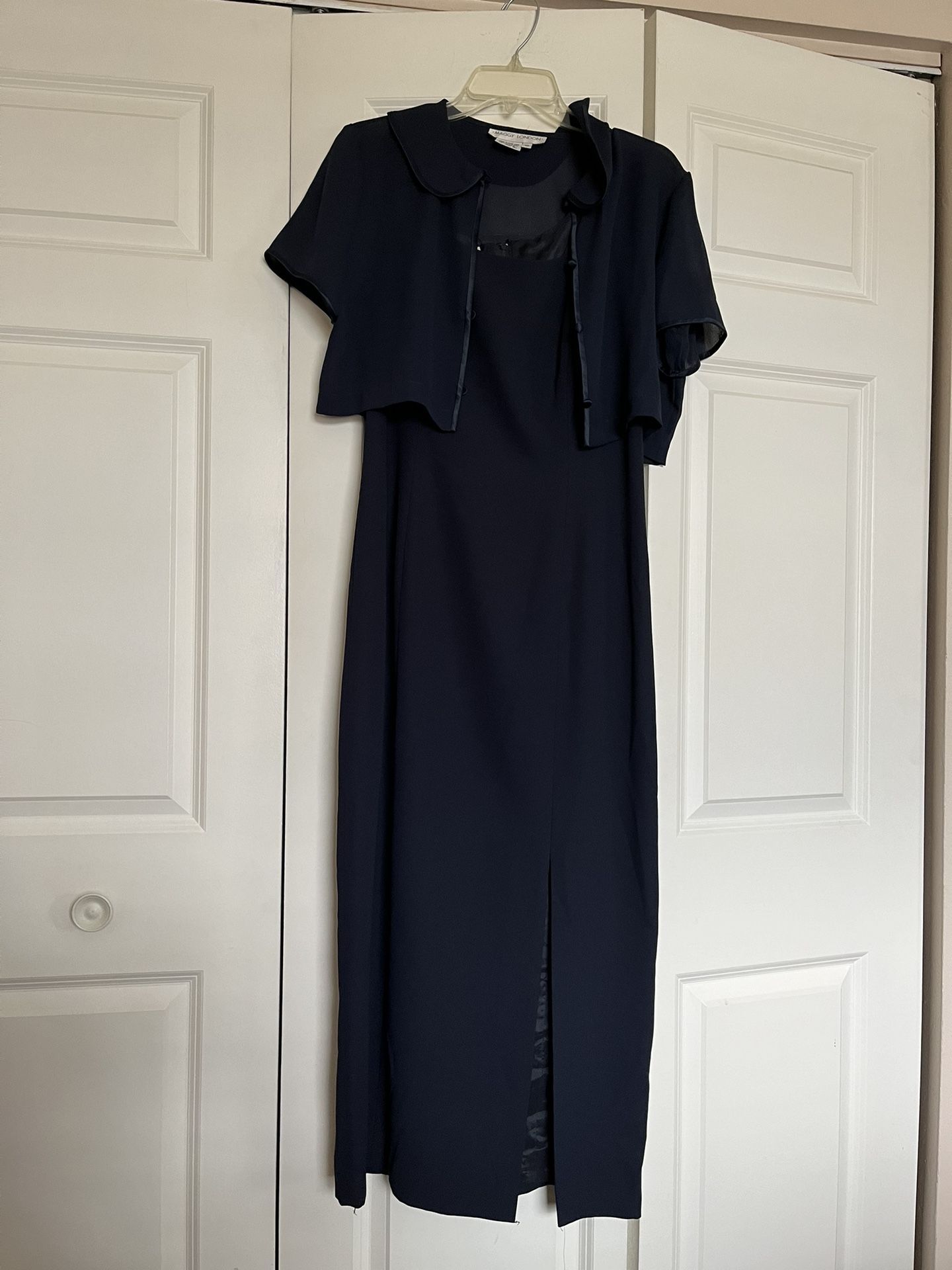 It’s A Beautiful Evening Dress In Size 10 The Color Is Navy Blue It’s A Two Piece It’s long Dress It’s Made By MAGGY LONDON