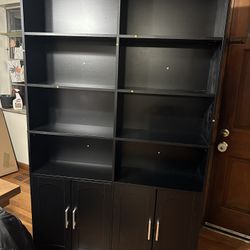 Kirklyn 73" H Standard Storage Bookcase with Doors and 8 Open Shelves, Modern Wood Organizer. Assembled, looks great. Right door appears to have a mar