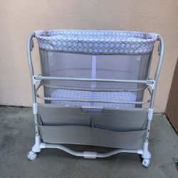 Lightly used Ingenuity bedside bassinet in excellent condition. Mesh sides for airflow, adjustable height, and storage shelf underneath. Perfect for n