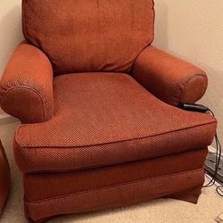 Two Rust Upholstered Swivel Chairs