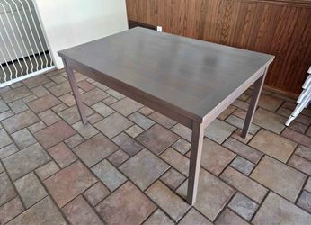Teak dining table. Seats up to 10 when leafs are pulled out.