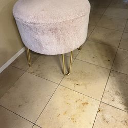 pink chair with gold