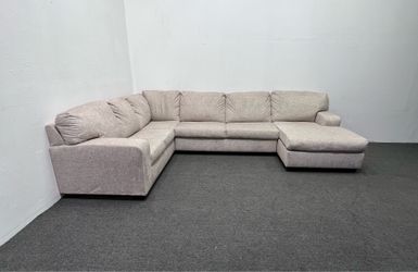 Ashley Light Beige Sectional with right facing Chaise. We deliver & setup.