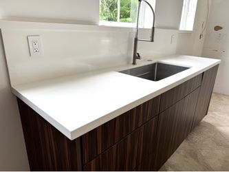 Large White Quartz Waterfall Island & Countertop with backsplash