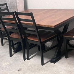 wood dining table with four chairs 