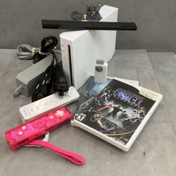 Wii game console with paddles accessories two games Star Wars, the force unleashed and resident evil