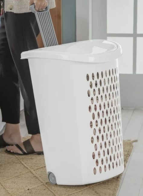 Selling a white laundry basket with a wheeled design! It's great for easily moving laundry around your home.   Dimensions: - Width: 15 3/8 inches (39.