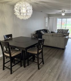 Dining room table sofa loveseat oversized chair and half and coffee table with end tables