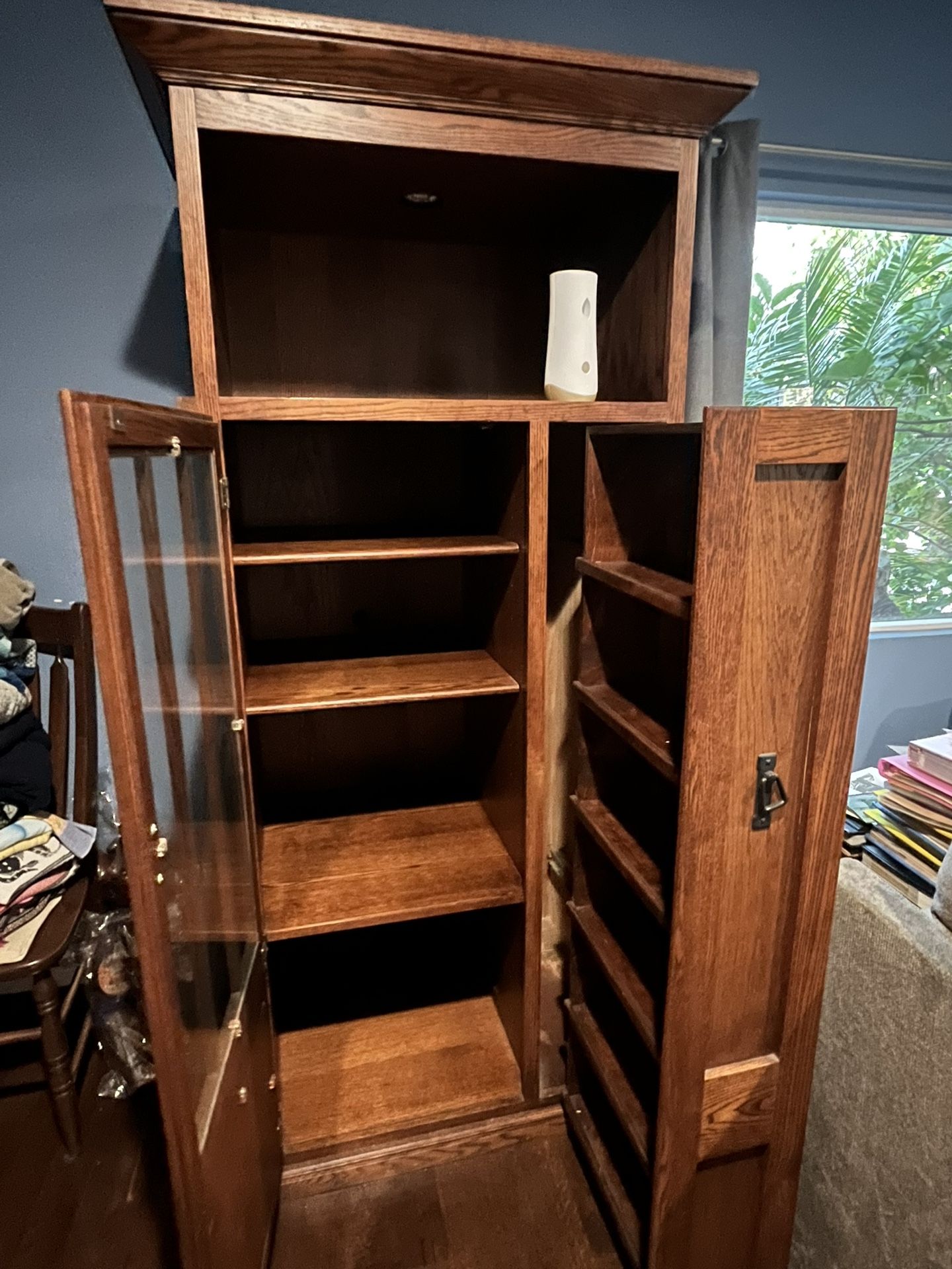 Its A Cabinet With Shelfs Inside With Glass Door Brown