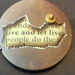 "Live and let live " bronze locket 