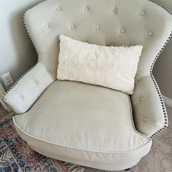 An exquisite vintage tufted armchair