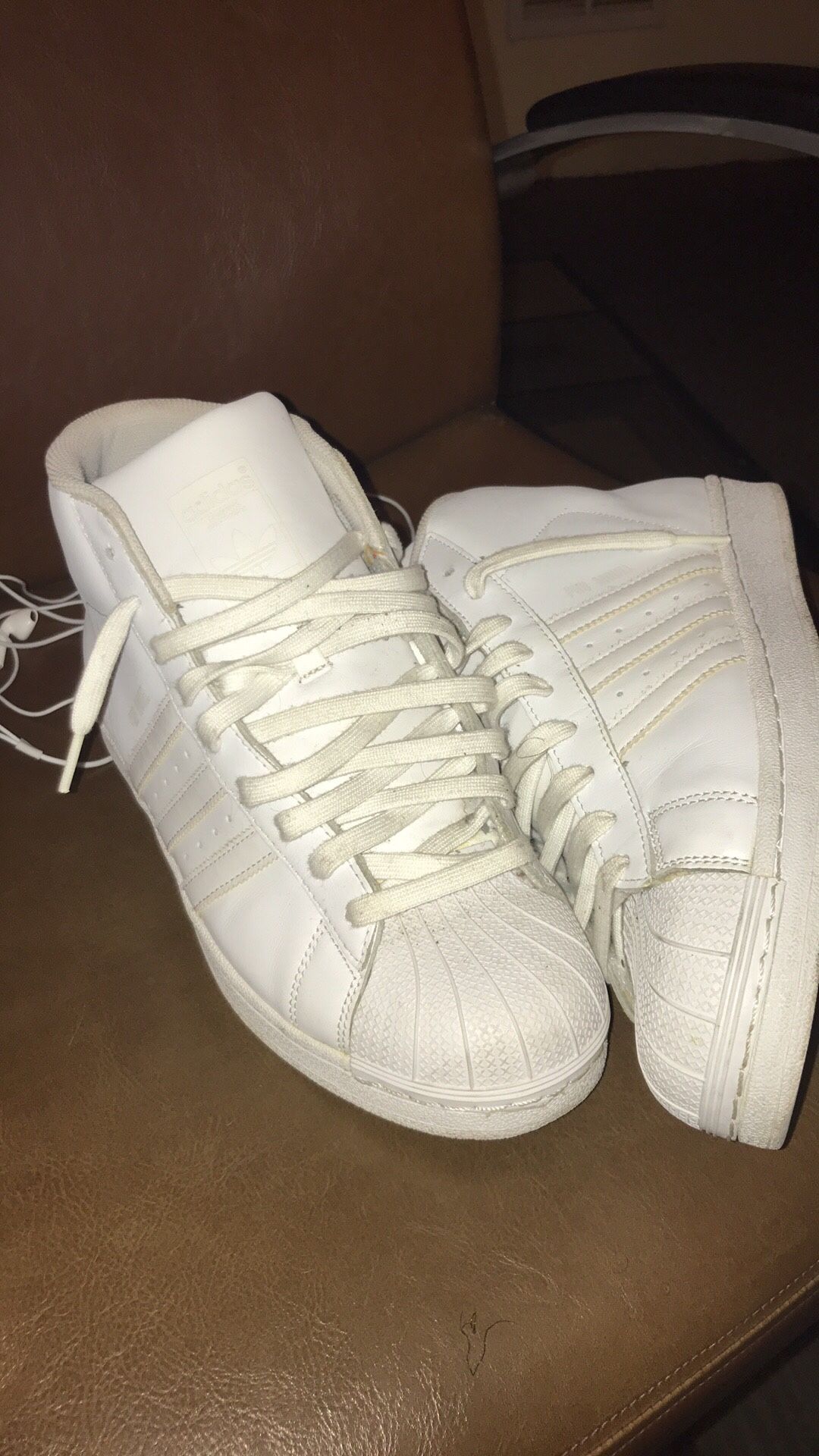 All white adidas, Timberland work boots, and custom made never worn levi shorts