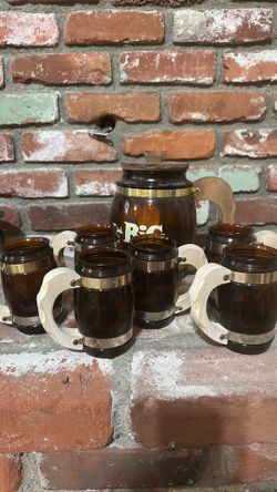 Vintage THINK BIG brown glass pitcher and six matching mugs.