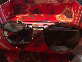 Ladies sunglasses with a red and black print