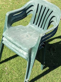Three Green Plastic Lawn Chairs