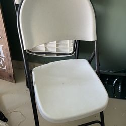 Two White Folding Chairs