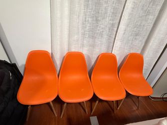 4 Orange chairs like new pickup only