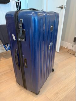 Tumi hard side spinner check in bag