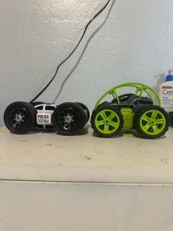 Toy cars green car and blue police car