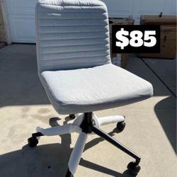 Brand New. Grey Armless Task Chair. Adjustable Height/Swivel.  $85