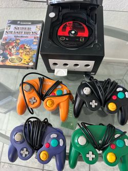 Nintendo gamecube plus 4 controllers and Super Smash Melee