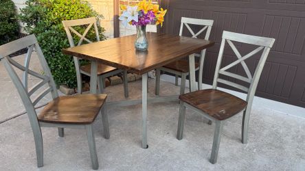 Beautiful Wooden Dining Set. Table with 4 matching chairs. Good condition, very sturdy!