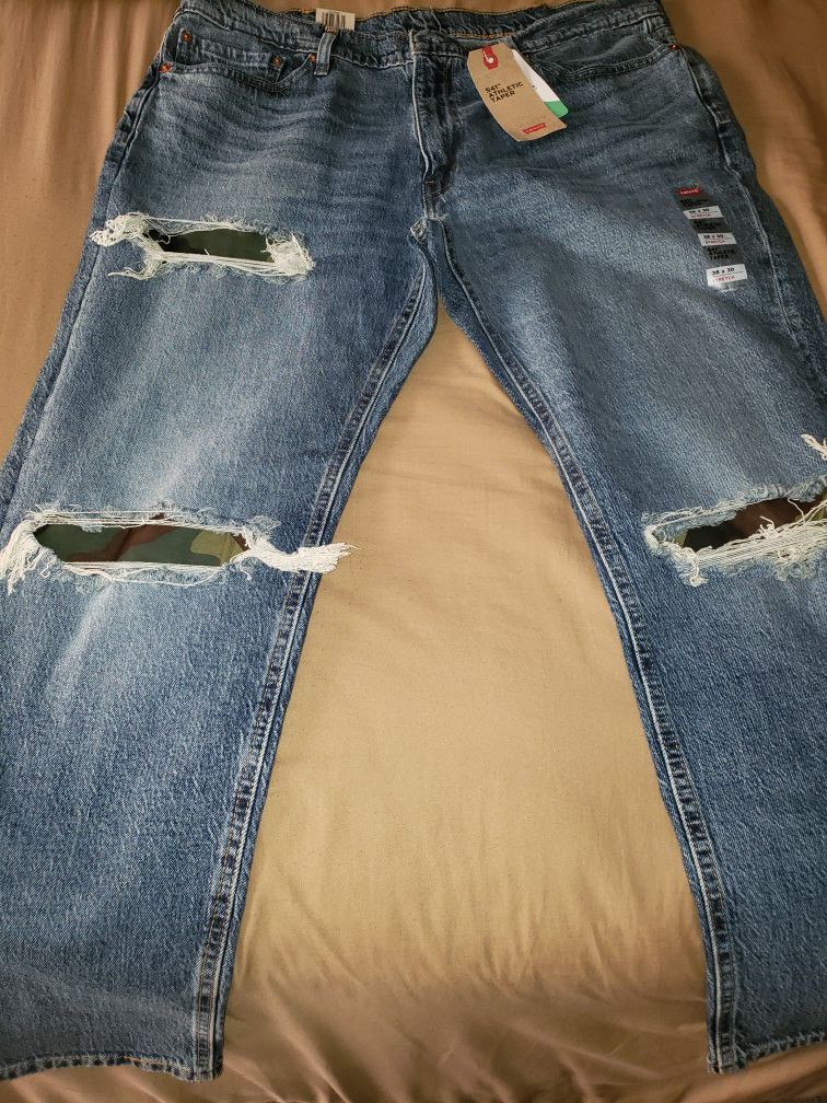 FIRM PRICE - Levi distressed camo blue jeans. Athletic fit size 38x30.