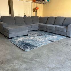 Ashley’s Furniture Grey Sectional Sofa with Chaise