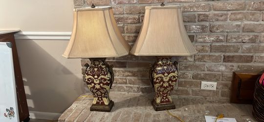 Elegant red and cream high end pair of table lamps.  From a family estate.  30 in tall 