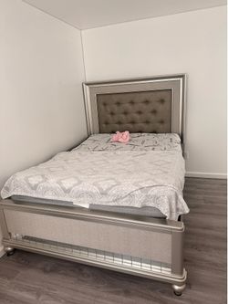 Bed frame, vanity , and dresser for sale.