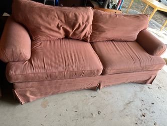 Red and White checkered couch with pillows